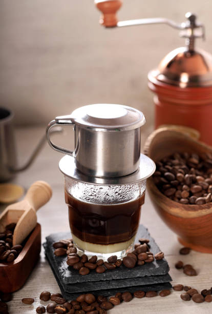 istock Vietnamese style drip coffee with condense milk, with low key scene 1360696303