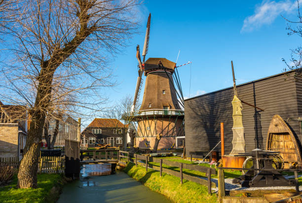 historical dutch windmill in the oudeschild village on the island of texel - oudeschild imagens e fotografias de stock