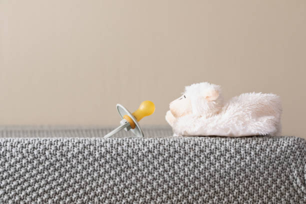 istock Dummy pacifiers for newborns close up. baby concept background 1360701402