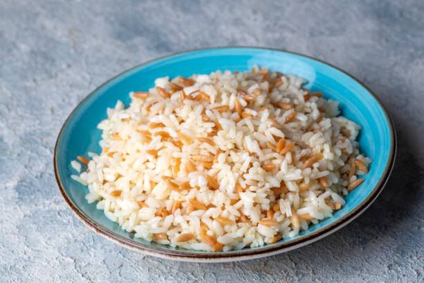 Traditional delicious Turkish food; Turkish style rice pilaf (Turkish name; Arpa sehriyeli pirinc pilavi) Traditional delicious Turkish food; Turkish style rice pilaf (Turkish name; Arpa sehriyeli pirinc pilavi) ARPA stock pictures, royalty-free photos & images