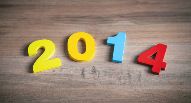 istock Happy New Year. 2014 on wooden background 1360706637