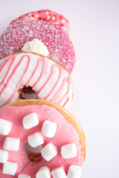 istock Pink dessert - cute donuts with marshmallow decorations 1360714503