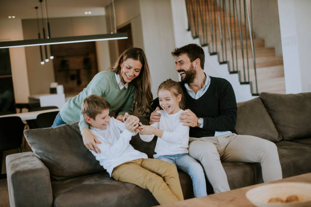 istock Siblings fighting over TV remote control at home 1360715354