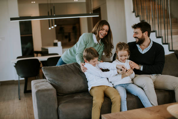 istock Siblings fighting over TV remote control at home 1360717532
