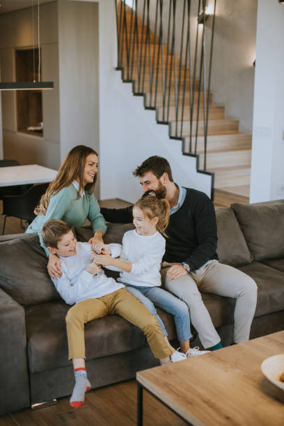 istock Siblings fighting over TV remote control at home 1360717539