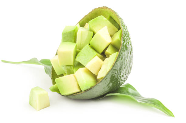 istock Green avocado isolated over a white background 1360718288