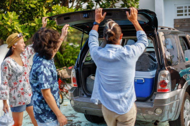 istock loading luggage into car trunk for their vacation 1360719410