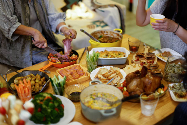 istock Happy family enjoying Christmas dinner 1360720392