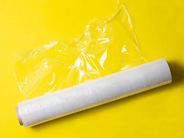 istock roll of wrapping stretch film for packaging on yellow background isolated 1360724501