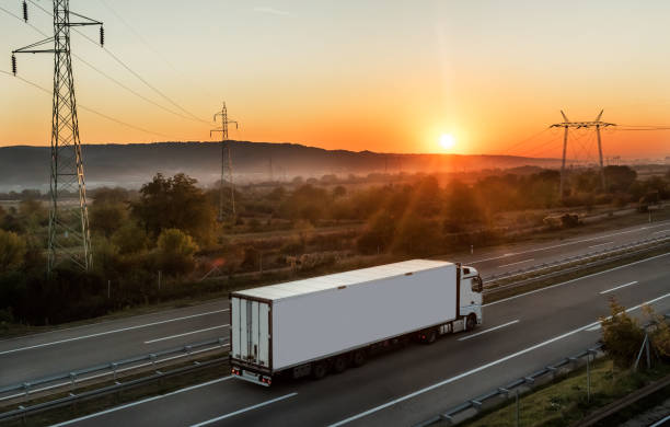 istock White truck on highway 1360724599