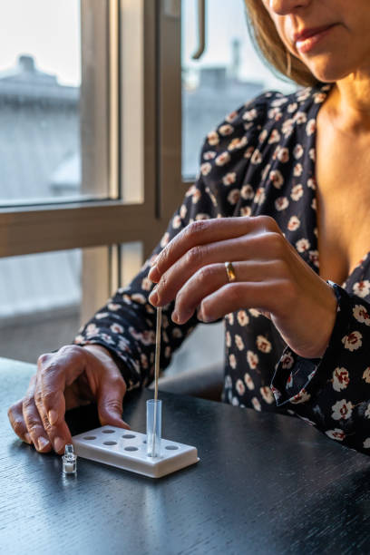 istock A woman doing a Covid-19 rapid test. 1360726741