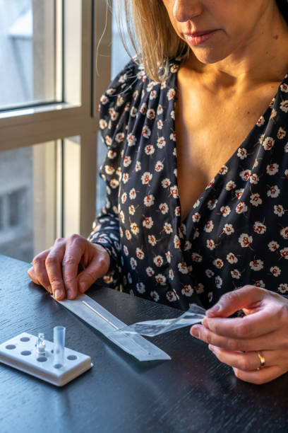 istock A woman doing a Covid-19 rapid test. 1360726810