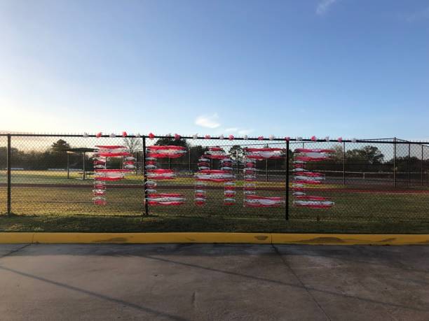 istock The word Peace written with plastic ribbon on a fence 1360727599