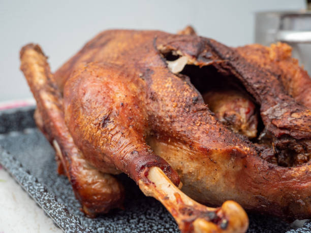istock Close up of roast goose with blurred background 1360728636