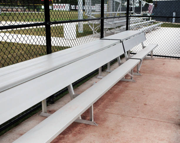 istock Dugout for baseball team at local baseball field. 1360728815