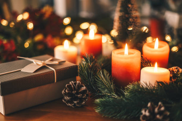 istock Christmas present and candles on the table 1360733208