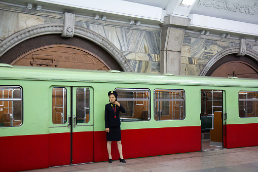 Unidentified female stuff in uniform at the Pyongyang Metro in North Korea. It is the rapid transit system which consist of two lines, opened at 1973.