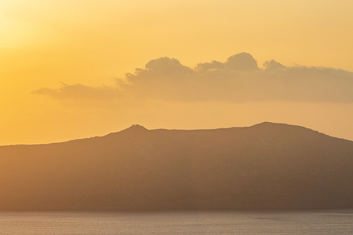 Atmospheric Haze at Sunset over Santorini Caldera in South Aegean Islands, Greece