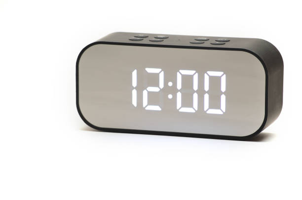 istock Clock with a time of 12 hours 00 minutes on a white background 1360742117