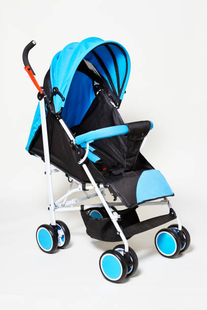 istock Blue baby stroller for newborn and toddler isolated on white background. 1360742921
