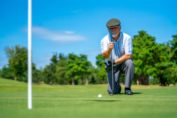 istock Asian senior man golfing at golf course on summer vacation 1360743613