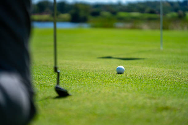 istock Asian senior man golfing at golf course on summer vacation 1360743614