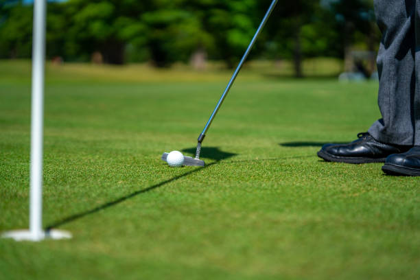 istock Asian senior man golfing at golf course on summer vacation 1360743615