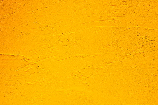istock Yellow grunge background. Old plastered wall 1360744960