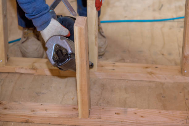 istock A carpenter for nailing wooden beam using an air hammer 1360751520