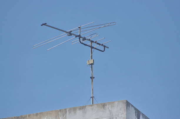 Old TV antenna installed on the roof of the building. Old TV antenna installed on the roof of the building. animal antenna stock pictures, royalty-free photos & images