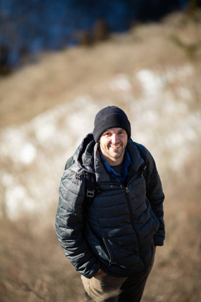 istock Rugged mountain man enjoying winter mountain hiking 1360753295