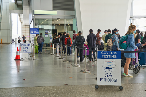 Adelaide, Australia - 15 Dec 2021: People waiting for COVID-19 test outside of Adelaide Airport