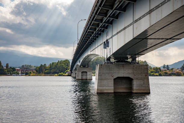 istock Bridge and pillars connecting two shores 1360762462