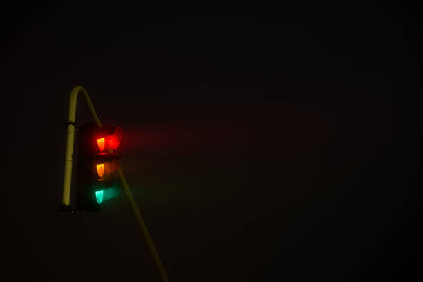 istock traffic lights in thick fog 1360771167
