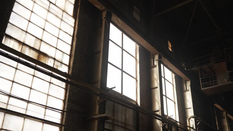 Abandoned power plant with large windows - Abandoned factory. Industrial plant with large windows