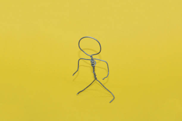 istock Human figure made of metal wire with an object 1360783194