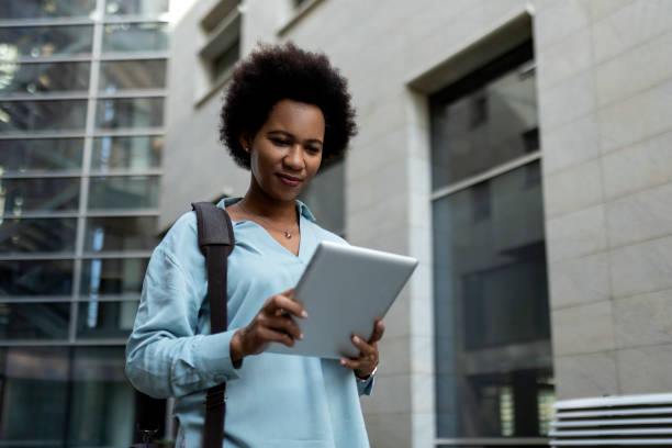 istock Businesswoman with digital tablet 1360785877