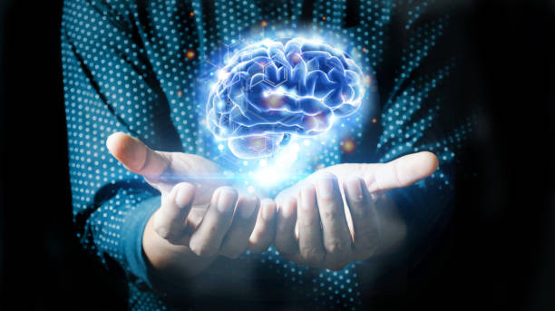istock Businessman holding human brain . 1360787323