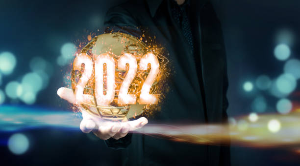 istock Businessman holding virtual 2022 number 1360787332
