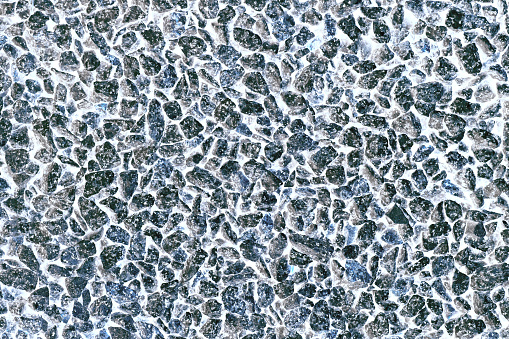 Very interesting background of pebbles highlighted in white