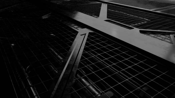 Abstract steel grate in dark scene
