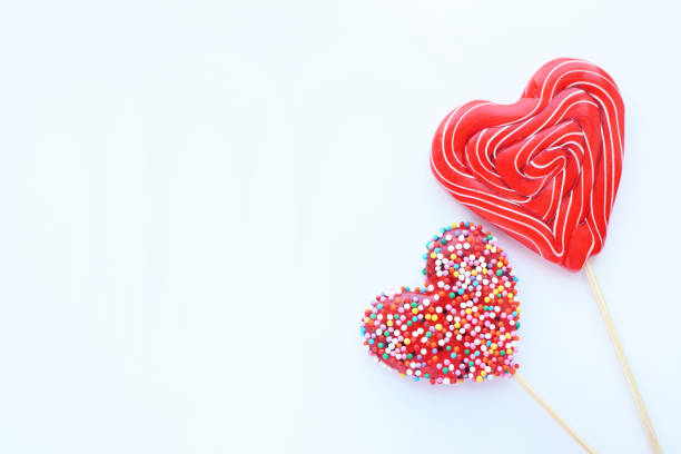 Valentines Day Gift and Lollipop Decorations for a Party on Retro Wood Background