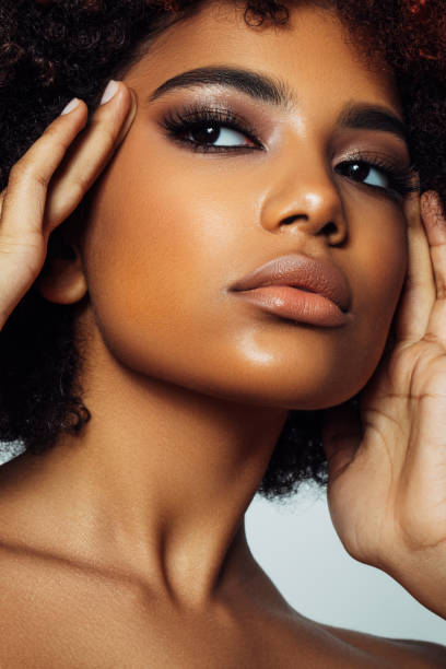 istock Beautiful afro woman with perfect make-up 1360795721