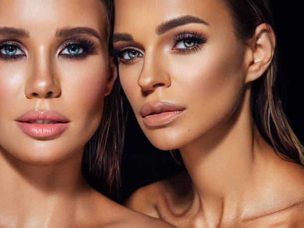 istock Two beautiful emotional women with perfect make-up 1360797059