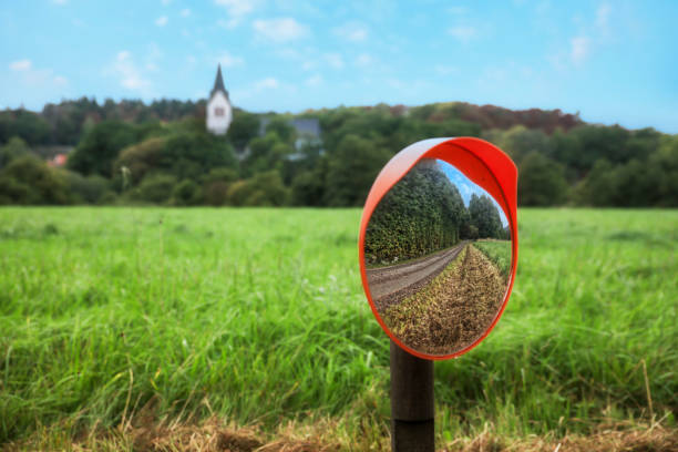 Traffic safety mirror Traffic safety mirrors in non-urban enviroment gravel road convex stock pictures, royalty-free photos & images