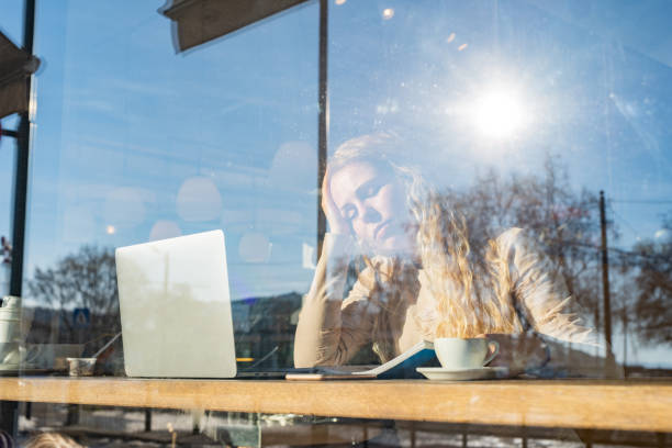 istock Female student studying in coffee shop 1360798249