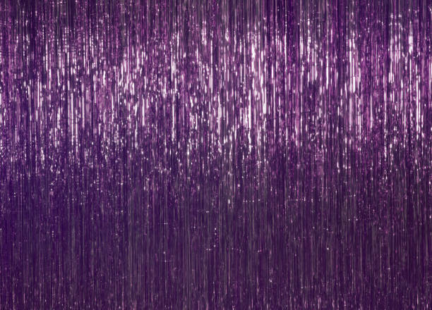 festive background. purple foil decor, tinsel. festive and cheerful mood. - tinsel imagens e fotografias de stock