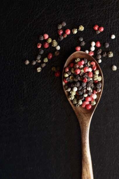 istock red white and black peppercorns seasoning on black background 1360799650