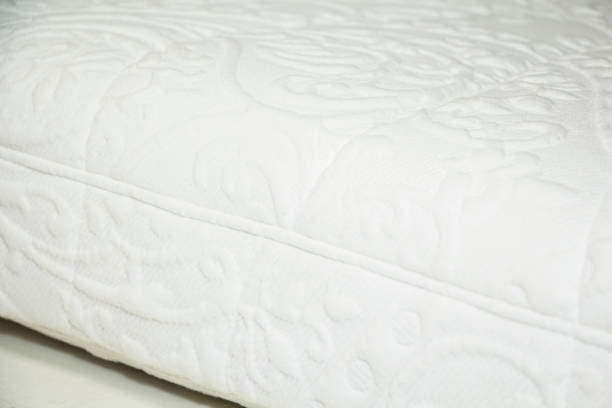 istock Close-up of the mattress background, white mattress fabric with patterns 1360800507
