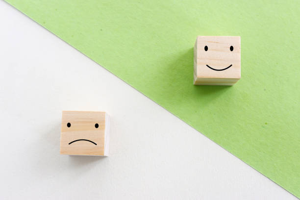 istock Concept image of satisfaction level. wooden cubes with emotions 1360802221